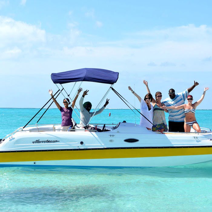 Friends waving arms on a turks and caicos island tour