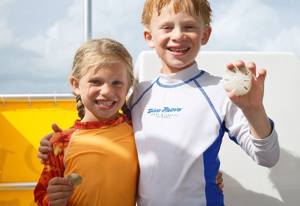 Children shell hunting in Turks and Caicos Islands