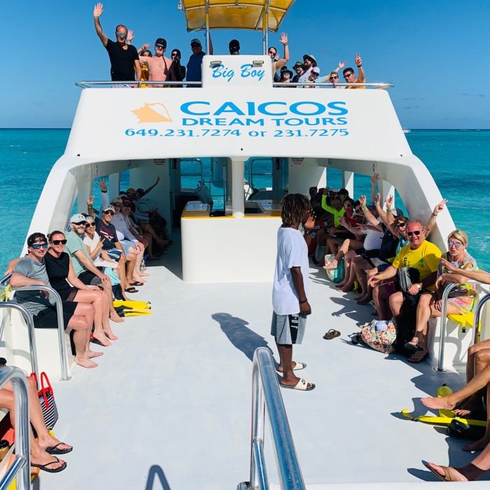 Group of snorkelers depart out to sea