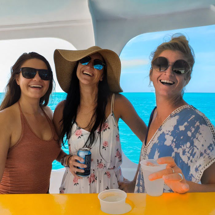 Girls enjoy drinks on private cruise
