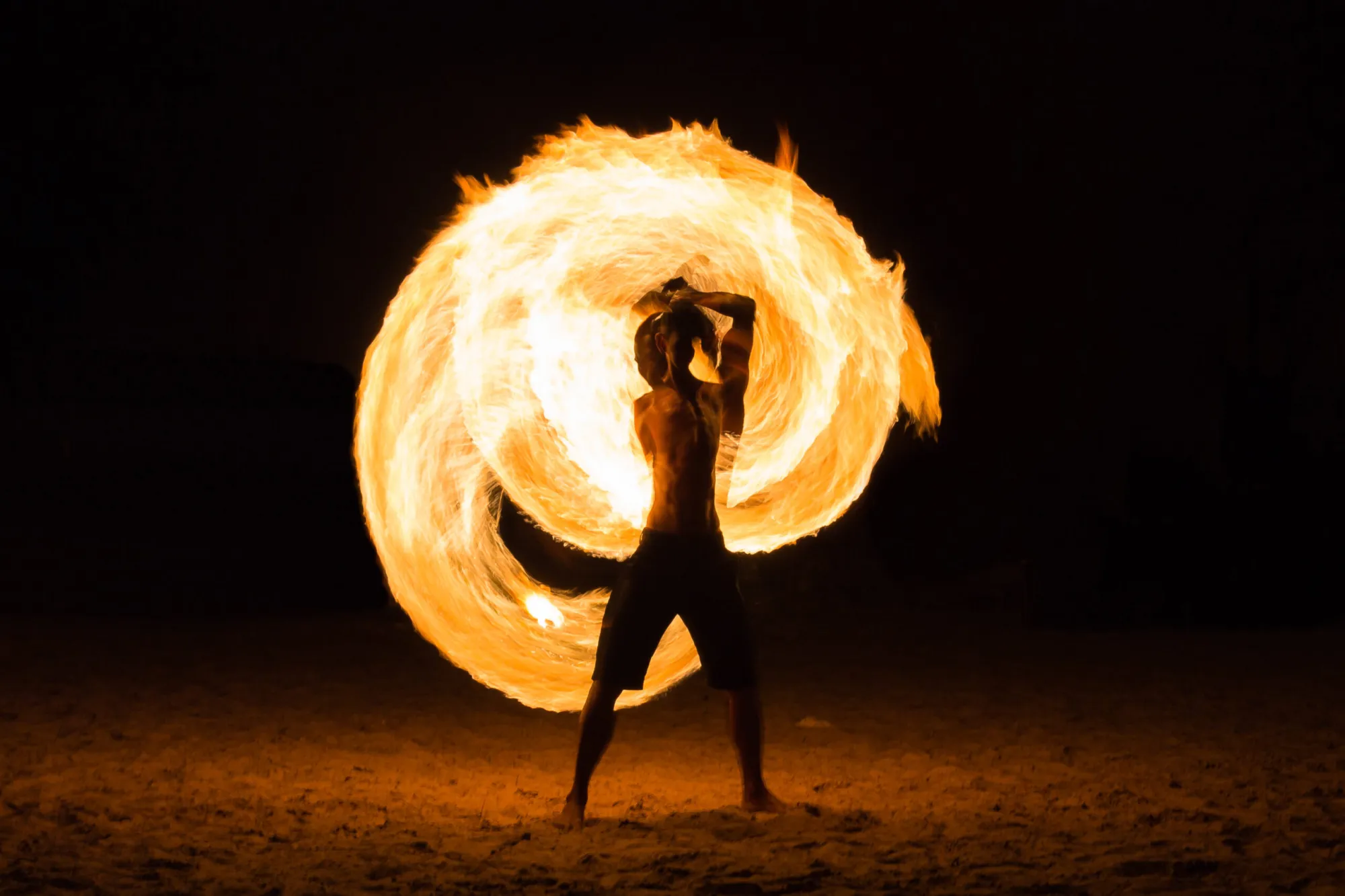 Man Fire Show on the beach Fire dancer on the beach