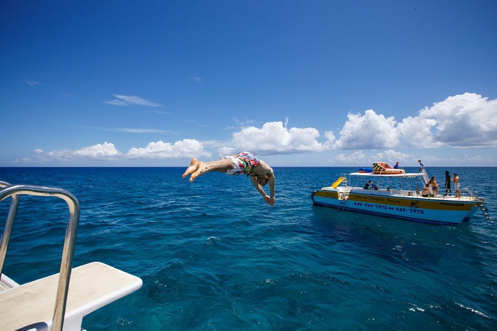 a group of people on a boat in a body of water
