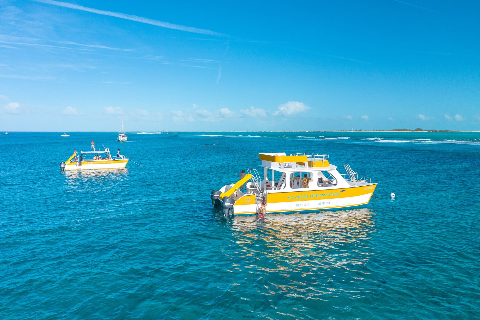 a private charter boat anchors near a sandbar