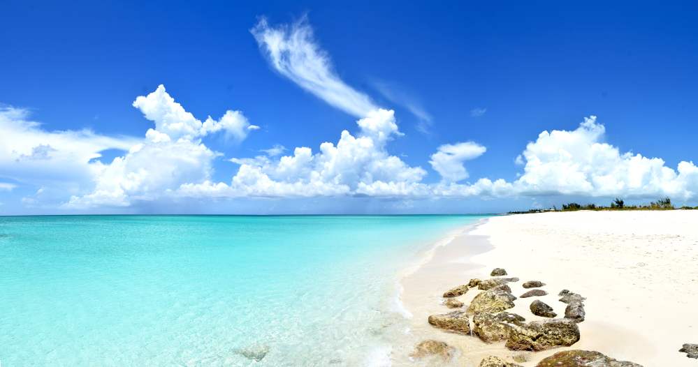 A peaceful beach in Turks and Caicos with a clear blue ocean