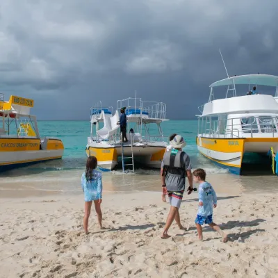 a boat sitting on top of a sandy beach