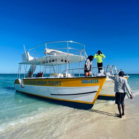 a man standing on a boat in the water
