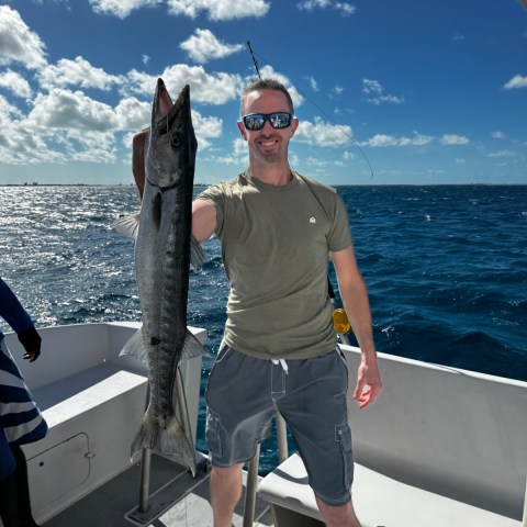 a couple of people that are standing in the water