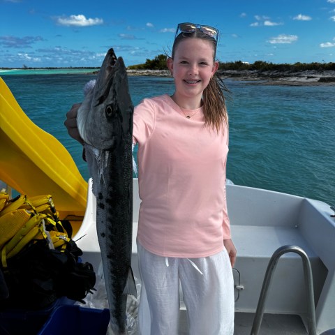 a person standing in front of a body of water