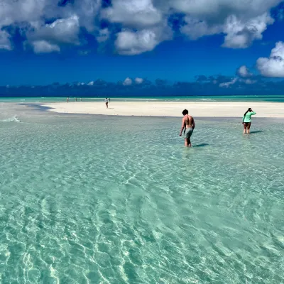 a man riding a wave on a surfboard in the ocean