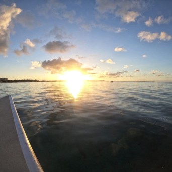 a sunset over a body of water
