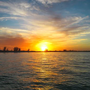 a sunset over a body of water
