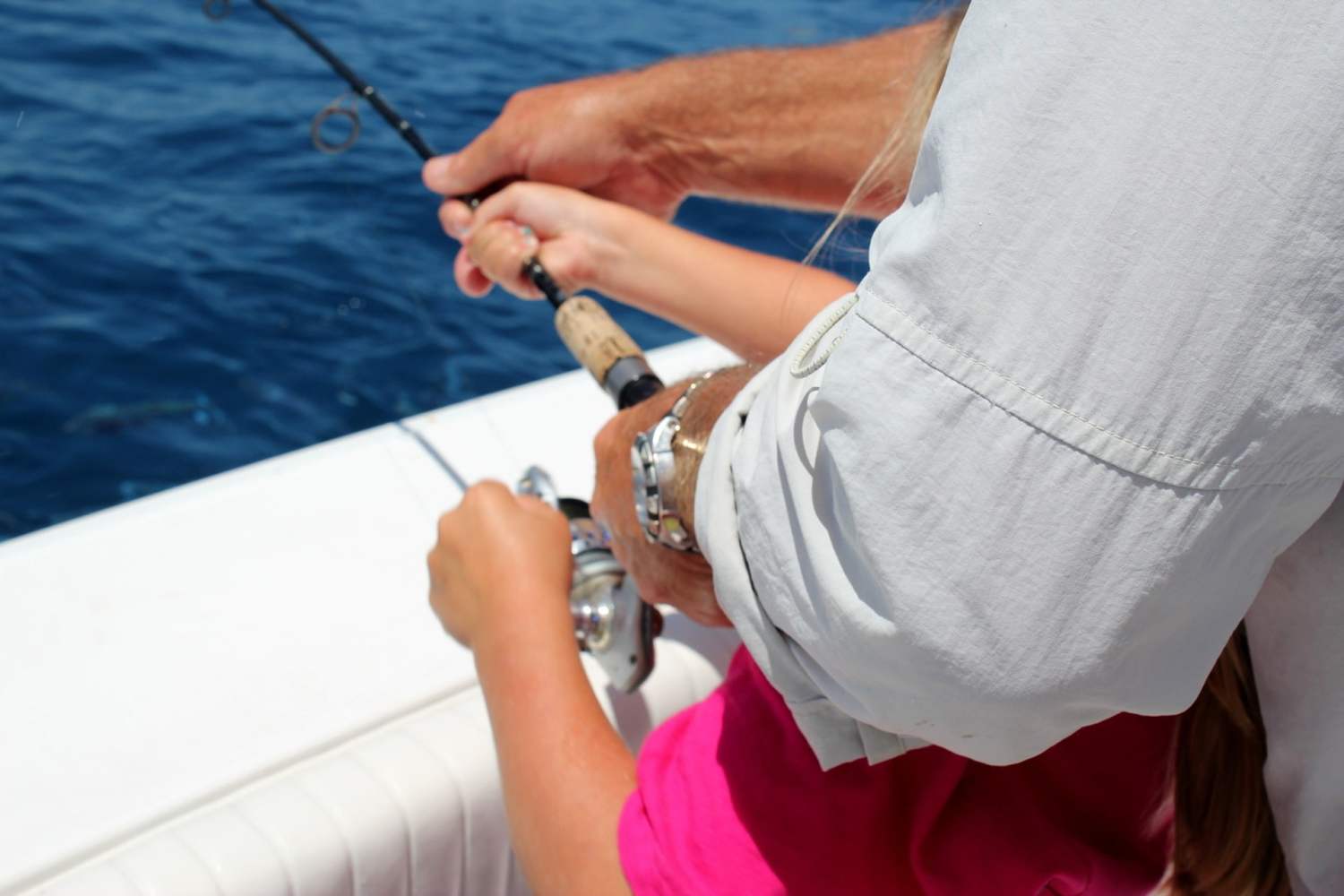 a person holding a fishing rod in the water
