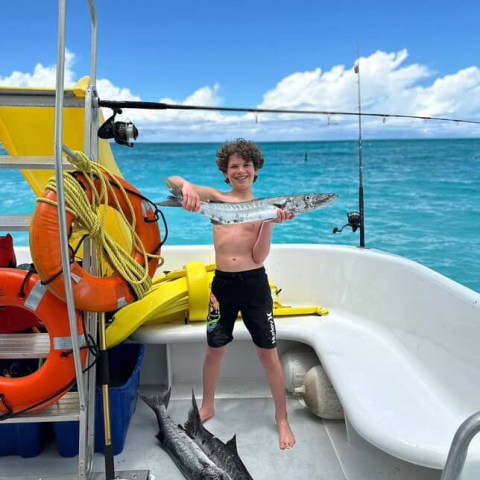 a person standing in front of a boat