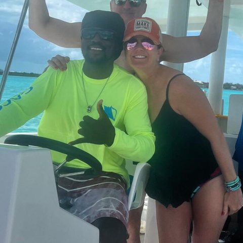 a person sitting on a boat in the water
