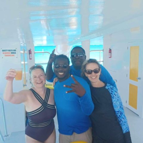 a person standing in front of a window posing for the camera