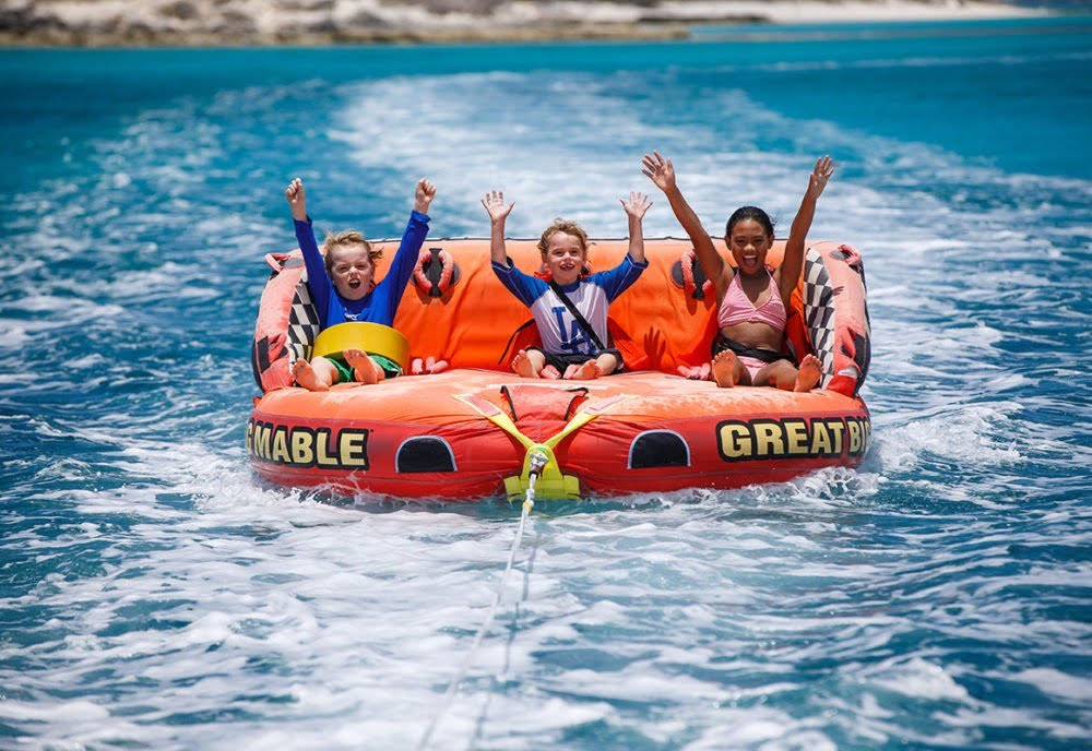 a group of people swimming in a body of water