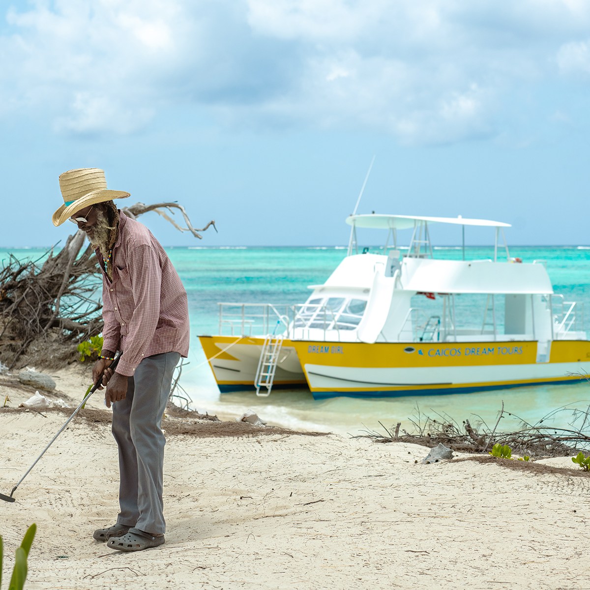 a person sitting in a boat on the beach