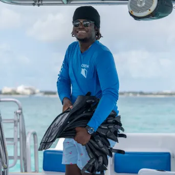a couple of people riding on the back of a boat